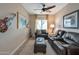 Relaxing living room with leather furniture and a cozy atmosphere at 16464 W Piccadilly Rd, Goodyear, AZ 85395