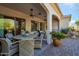 Outdoor patio with seating area, ceiling fans, and fountain views at 16464 W Piccadilly Rd, Goodyear, AZ 85395