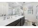 Modern bathroom with a double vanity and a large mirror at 1705 S 82Nd Pl, Mesa, AZ 85209