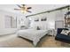 Bright bedroom featuring a king-size bed and decorative accents at 1705 S 82Nd Pl, Mesa, AZ 85209