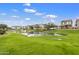 Peaceful pond with lush green landscaping at 1705 S 82Nd Pl, Mesa, AZ 85209