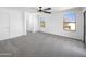 Bright bedroom with ceiling fan and plush gray carpeting at 1708 E Galveston St, Gilbert, AZ 85295