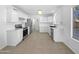 Modern kitchen with white cabinets, stainless steel appliances, and tile floor at 1708 E Galveston St, Gilbert, AZ 85295