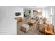 Bright living room with mid-century modern furniture and tile floors at 1708 E Galveston St, Gilbert, AZ 85295