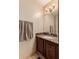 Small bathroom with granite countertop and dark wood vanity at 1740 W Del Rio St, Chandler, AZ 85224