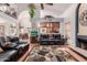 Living room with hardwood floors, fireplace, and view into kitchen area at 1740 W Del Rio St, Chandler, AZ 85224