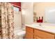 Clean bathroom with tub shower combo, wood vanity, and updated fixtures at 18109 W Skyline Dr, Surprise, AZ 85374