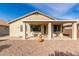 Large covered patio with outdoor seating and grill at 18109 W Skyline Dr, Surprise, AZ 85374