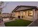 Relaxing backyard with fire pit and covered patio at 19021 W Rose Ln, Waddell, AZ 85355