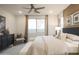 Bright bedroom with large window and ceiling fan at 19021 W Rose Ln, Waddell, AZ 85355