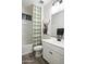 Bathroom with tub, toilet, vanity, and a decorative shower curtain at 19027 W Rose Ln, Waddell, AZ 85355