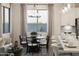 Casual dining area with a round table and chairs, adjacent to the kitchen at 19027 W Rose Ln, Waddell, AZ 85355