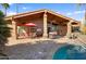 Outdoor patio area with seating, dining, and a pool at 19035 E Tonto Trl, Rio Verde, AZ 85263