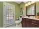 Updated bathroom with dark wood vanity, toilet and door to backyard at 19035 E Tonto Trl, Rio Verde, AZ 85263