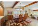 Elegant dining room with hardwood floors, a chandelier, and large windows at 19035 E Tonto Trl, Rio Verde, AZ 85263