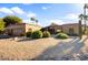 Single story home with attractive desert landscaping and a two car garage at 19035 E Tonto Trl, Rio Verde, AZ 85263