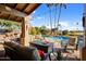 Relaxing pool area with seating and fire pit at 19035 E Tonto Trl, Rio Verde, AZ 85263