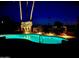 Inviting pool at night with colorful lighting at 19035 E Tonto Trl, Rio Verde, AZ 85263