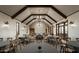 Spacious community room with farmhouse style lighting and gray tables at 1928 W Rowel Rd, Phoenix, AZ 85085