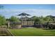 Modern playground with shade structure and landscaping at 1928 W Rowel Rd, Phoenix, AZ 85085