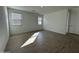 Bedroom with tile flooring and two windows at 22859 E Lords Way, Queen Creek, AZ 85142