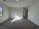 Bright bedroom featuring carpeted flooring and window at 22859 E Lords Way, Queen Creek, AZ 85142