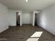 Spacious bedroom with tile floor and access to bathroom at 22859 E Lords Way, Queen Creek, AZ 85142