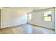 Well-lit bedroom featuring wood-look floors and ample space at 22859 E Lords Way, Queen Creek, AZ 85142