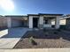 Single-story home with attached garage and landscaped front yard at 22859 E Lords Way, Queen Creek, AZ 85142