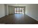 Bright living room featuring tile flooring and access to backyard at 22859 E Lords Way, Queen Creek, AZ 85142