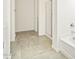 Clean bathroom with tile flooring, shower, and bathtub at 24 S 175Th Ave, Goodyear, AZ 85338