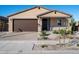 Single-story house featuring a two-car garage and desert landscaping at 24 S 175Th Ave, Goodyear, AZ 85338