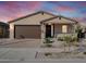 New single-story home with a brown garage door and stone accents at 24 S 175Th Ave, Goodyear, AZ 85338