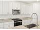 Modern kitchen features granite countertops and stainless steel appliances at 24 S 175Th Ave, Goodyear, AZ 85338