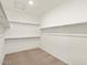 Large walk-in closet with ample shelving and hanging space at 24 S 175Th Ave, Goodyear, AZ 85338