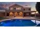 Night view of house and sparkling pool at 2602 W Trapanotto Rd, Phoenix, AZ 85086