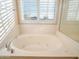 Relax in this bathroom's luxurious corner soaking tub at 2602 W Trapanotto Rd, Phoenix, AZ 85086