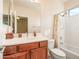 Clean bathroom with shower/tub combo and wood vanity at 2602 W Trapanotto Rd, Phoenix, AZ 85086