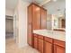 Bathroom boasts a spacious vanity with ample storage and a view into another room at 2602 W Trapanotto Rd, Phoenix, AZ 85086