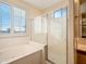 Spa-like bathroom with a large soaking tub and a separate shower at 2602 W Trapanotto Rd, Phoenix, AZ 85086