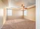 Large bedroom with ceiling fan and neutral colored carpet at 2602 W Trapanotto Rd, Phoenix, AZ 85086