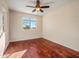 Bright bedroom with wood flooring and a ceiling fan at 2602 W Trapanotto Rd, Phoenix, AZ 85086