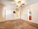 Bedroom with double doors leading to bathroom and carpet flooring at 2602 W Trapanotto Rd, Phoenix, AZ 85086