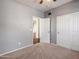 Bright bedroom with carpet flooring and a double door closet at 2602 W Trapanotto Rd, Phoenix, AZ 85086