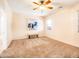 Spacious bedroom with carpet, ceiling fan, and large artwork at 2602 W Trapanotto Rd, Phoenix, AZ 85086