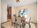 Bright dining room with wood table and four chairs at 2602 W Trapanotto Rd, Phoenix, AZ 85086