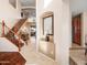 Bright entryway with a wooden staircase and tiled floors at 2602 W Trapanotto Rd, Phoenix, AZ 85086