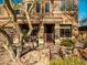 Landscaped front yard with a wooden bridge and stone accents at 2602 W Trapanotto Rd, Phoenix, AZ 85086