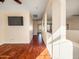 Light-filled hallway with wood flooring and views into other rooms at 2602 W Trapanotto Rd, Phoenix, AZ 85086