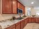 Modern kitchen with granite countertops and wood cabinetry at 2602 W Trapanotto Rd, Phoenix, AZ 85086